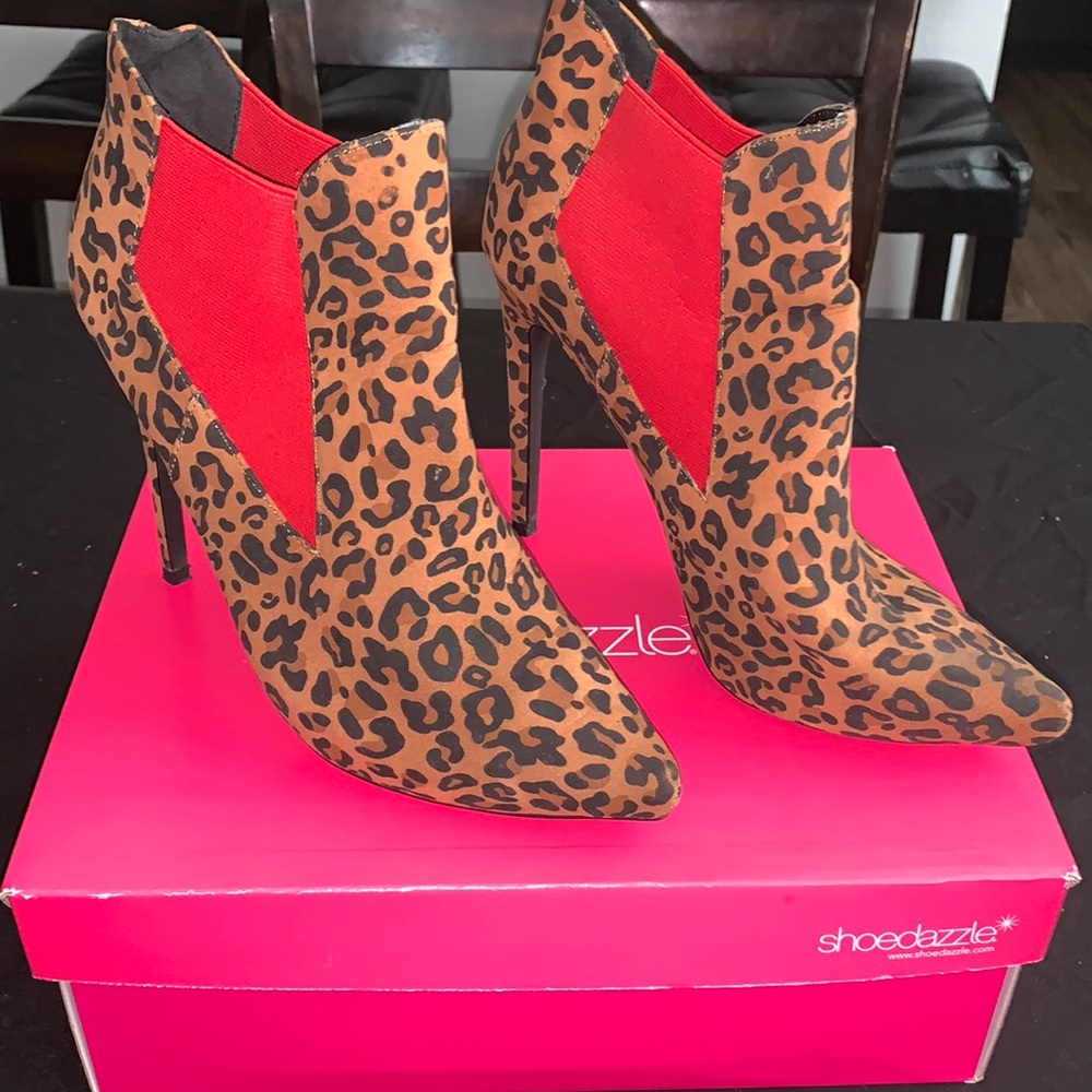 Animal print and red pair of ankle boot heels. Size 7.5. A shoe dazzle design